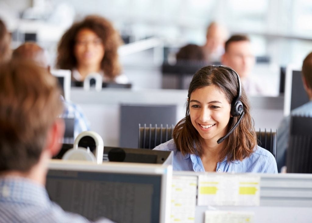 Happy woman working in a call centre
