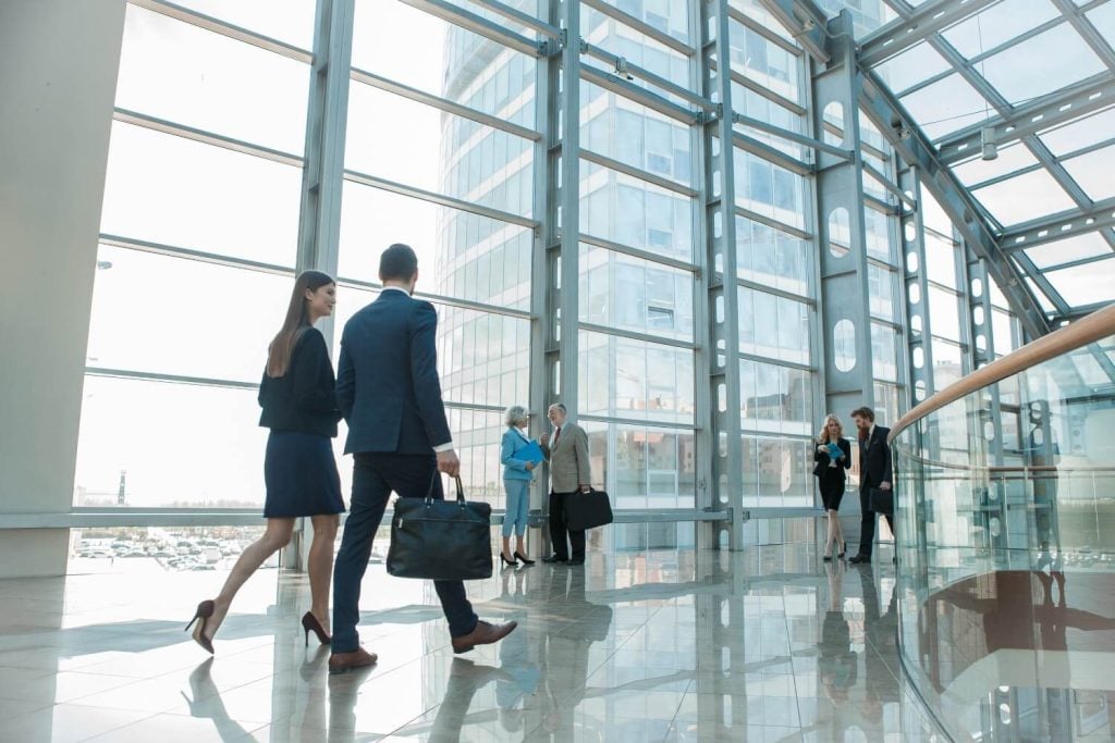 People walking in office lobby